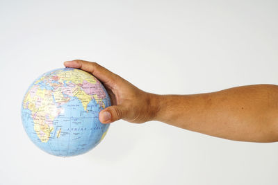 Low angle view of man hand against white background