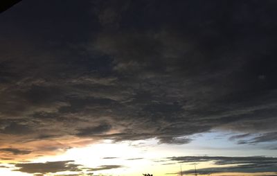 Low angle view of dramatic sky during sunset