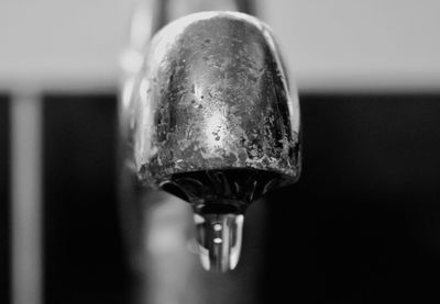 Close-up of water faucet in bathroom