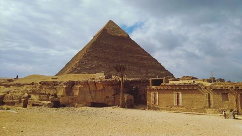 View of old ruin building against cloudy sky