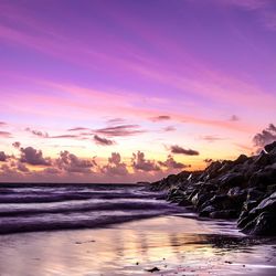 Scenic view of sea against sky at sunset