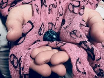 Close-up of hand holding baby