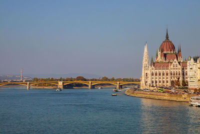 View of bridge over river against clear sky