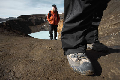 Couple hiking up from the askja caldera in the icelandic highlands