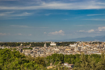 Buildings in city against sky