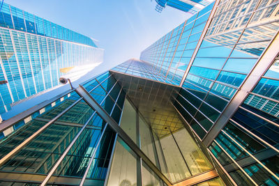 Low angle view of modern buildings against sky