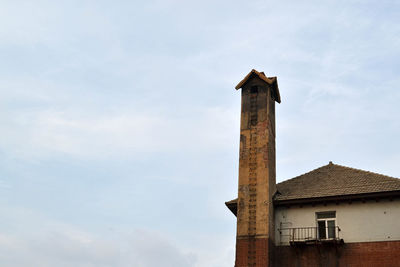 Low angle view of old building against sky