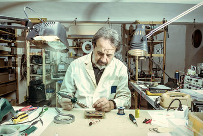 Portrait of young man working at clinic