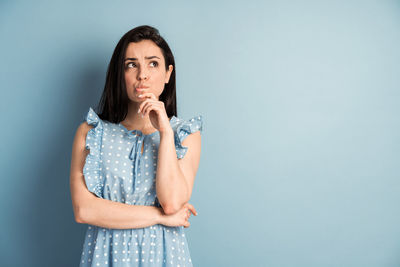 Portrait of a beautiful young woman over white background