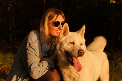 Portrait of young woman with dog