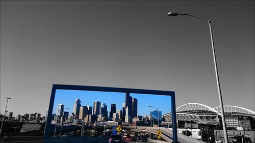 Skyscrapers in city against blue sky