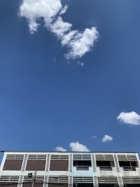 Low angle view of building against blue sky