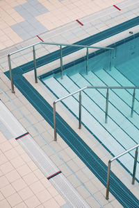 High angle view of steps in swimming pool against building