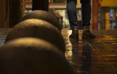 Low section of man walking on steps