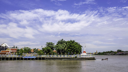 Scenic view of building against cloudy sky