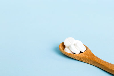 Close-up of pills on white background