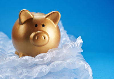 Close-up of stuffed toy against blue background