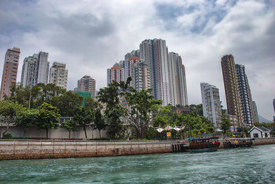 View of buildings against cloudy sky