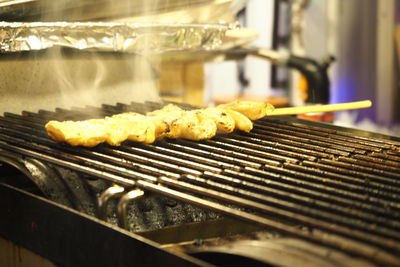 Close-up of meat on barbecue grill