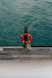 High angle view of bicycle tied on pier