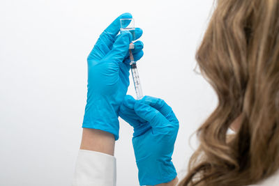 Midsection of woman holding umbrella