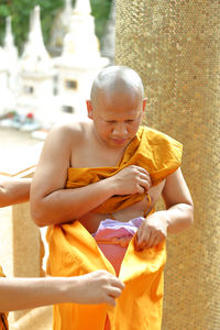 Monk during ordination ceremony at temple