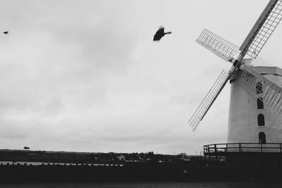 Traditional windmill against sky