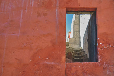 Rear view of man standing in tunnel