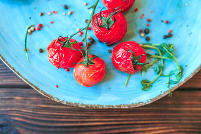 High angle view of strawberries in plate on table