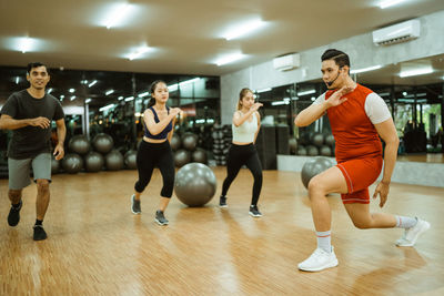 People exercising in gym