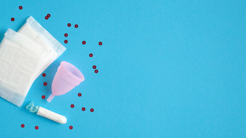 High angle view of drink on table against blue background