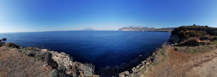 Scenic view of sea against clear blue sky