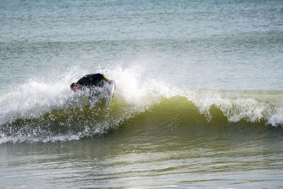 Man surfing in sea