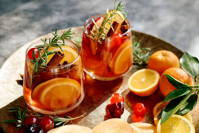 Mulled wine or christmas sangria with aromatic spices, apple, cherry and citrus fruits.