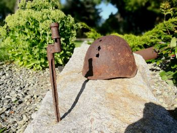 Close-up of rusty metal on rock