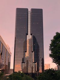 Low angle view of buildings against sky during sunset