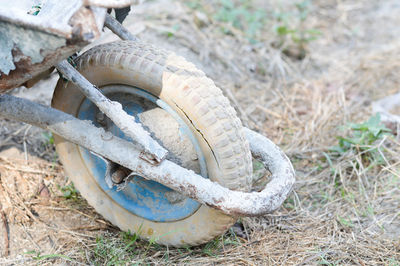 High angle view of abandoned tire on field