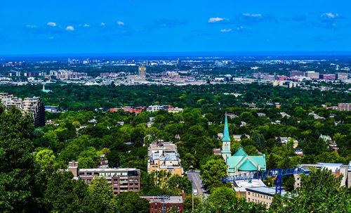 High angle view of townscape against blue sky