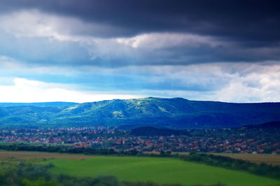 Scenic view of landscape and mountains against sky