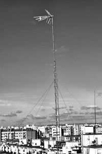 Low angle view of cranes against sky