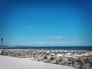 Scenic view of beach against sky in city