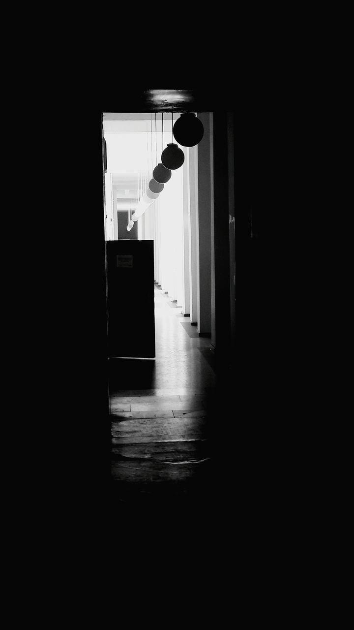 indoors, architecture, corridor, built structure, door, the way forward, window, dark, empty, doorway, entrance, wall - building feature, wall, narrow, illuminated, building, absence, sunlight, flooring, house