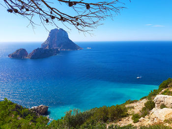 Naturalistic maritime panorama of es vedra in the sea of ibiza from cala d'hort in balearic islands