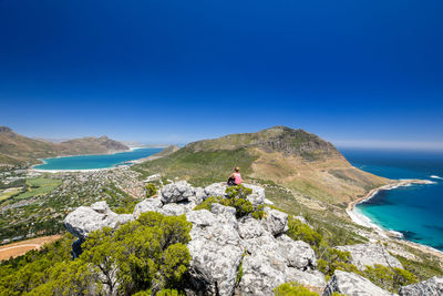 High angle view of woman looking at view against sky