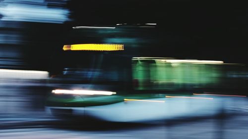 Blurred motion of bus on road