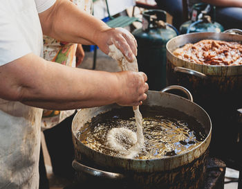 Midsection of person preparing food