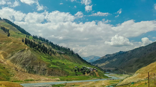 View of mountain range against cloudy sky