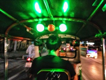 Illuminated train at night