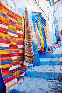 Multi colored flags hanging for sale in market