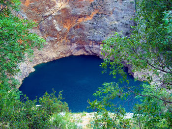 High angle view of rock formation in lake